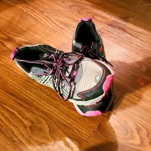 Purple Athletic tennis shoes made by ASICS